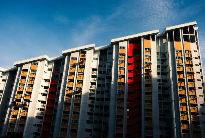 white and red concrete building under blue sky during daytime